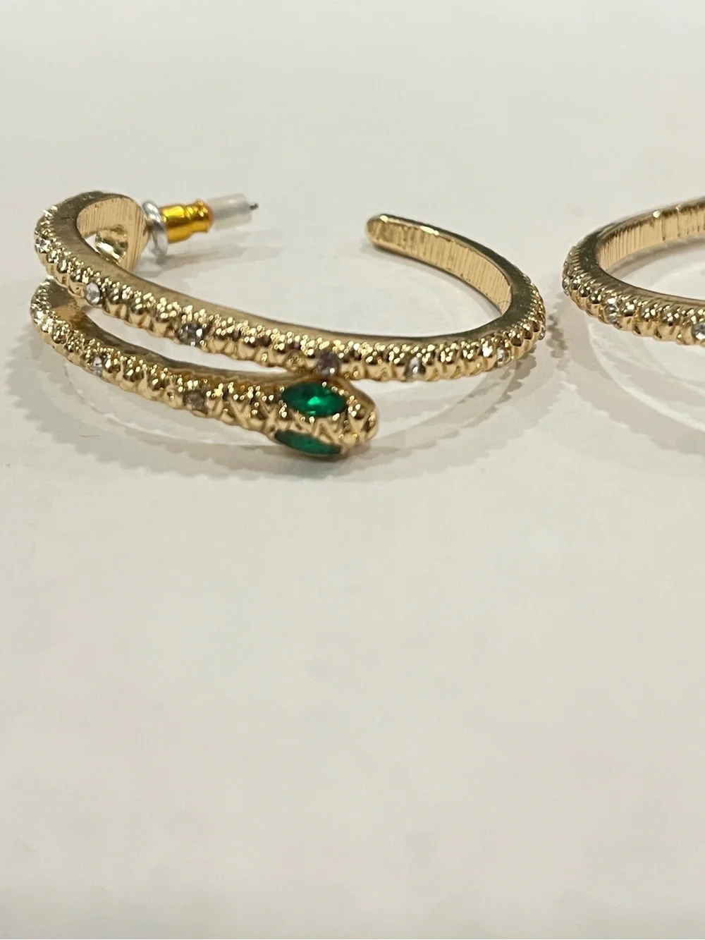 Gold Sparkle Snake Hoop Earrings with Green Eye Stone Accents